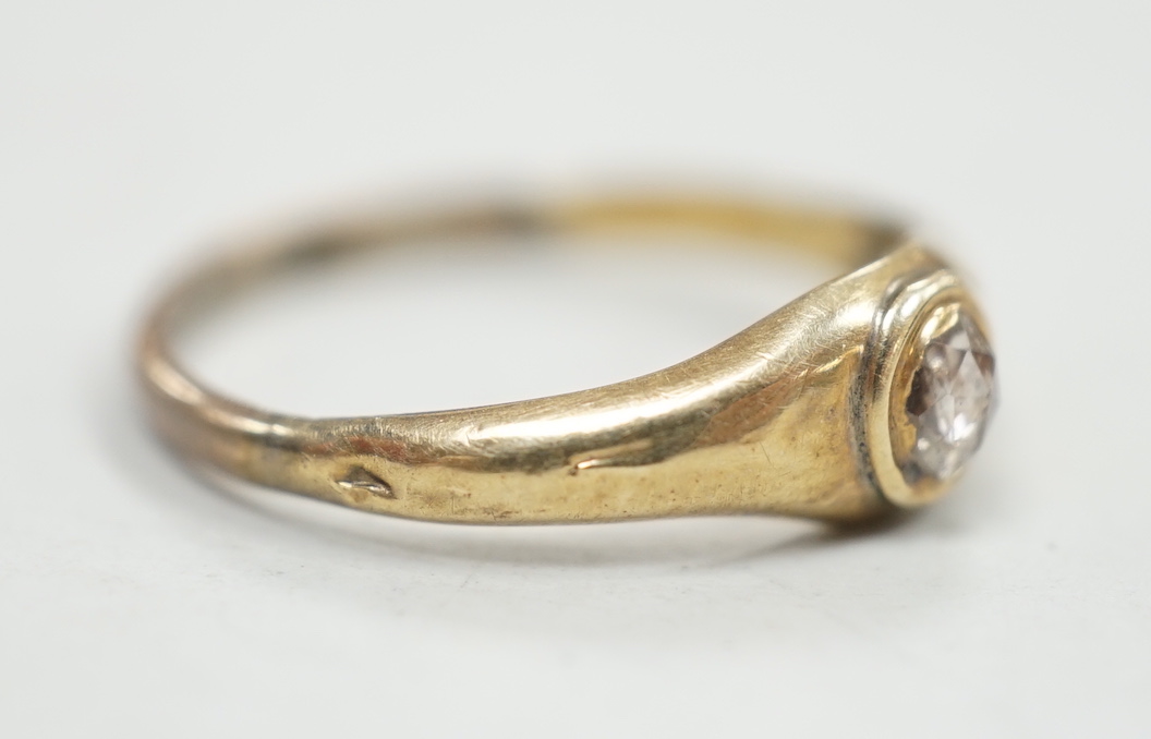 An antique yellow metal and single stone rose cut diamond set ring, size N, gross weight 1.1 grams.